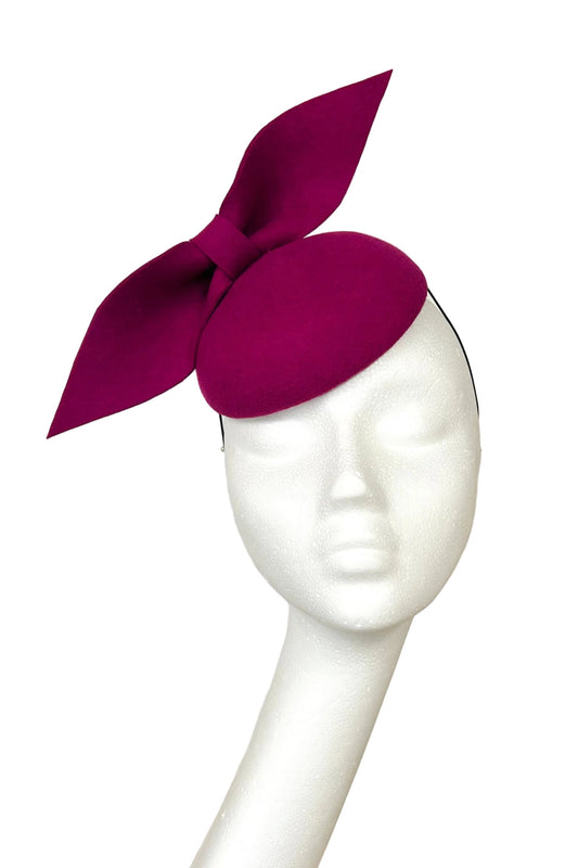 Raspberry pink headpiece for hire