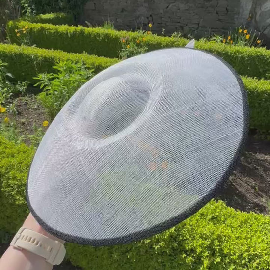 Large white hat with black trim to hire