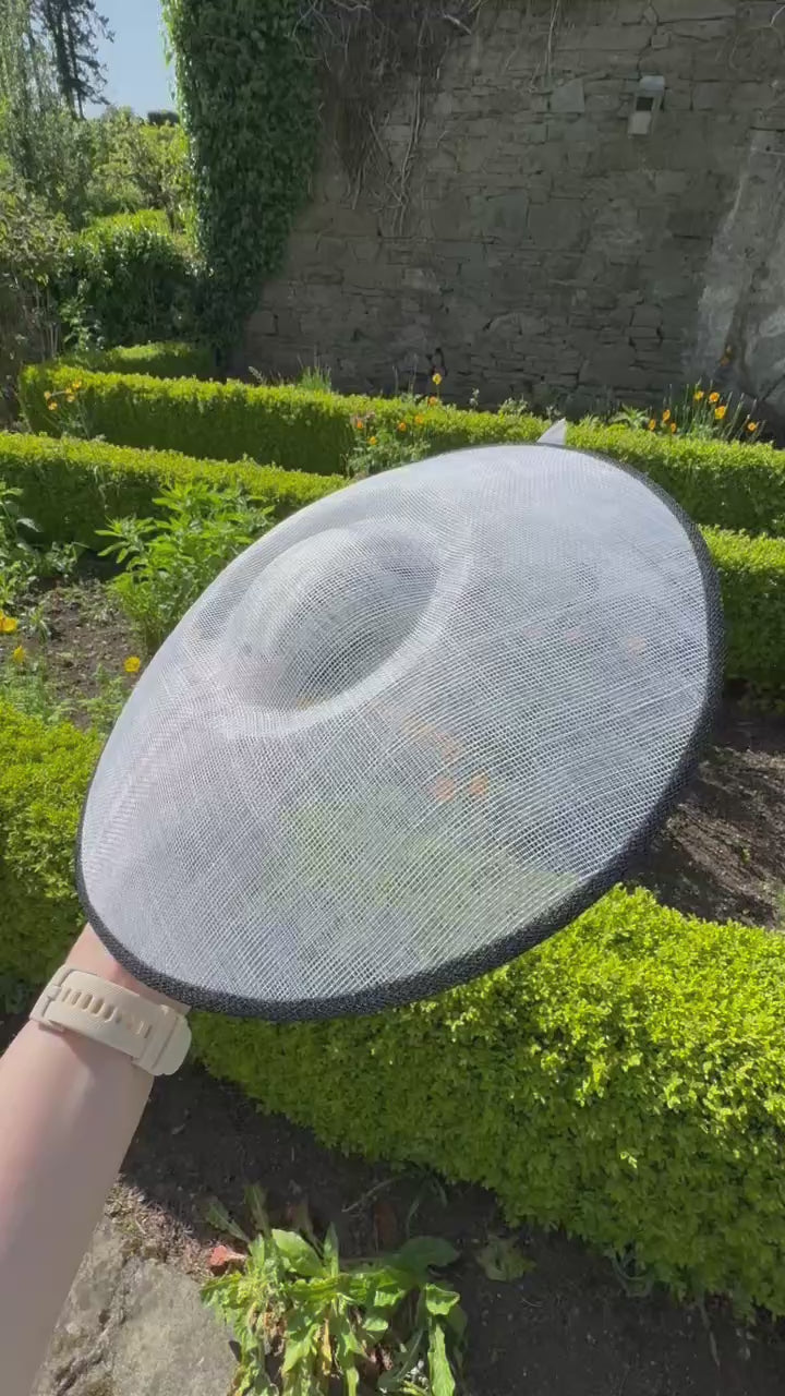 Large white hat with black trim to hire