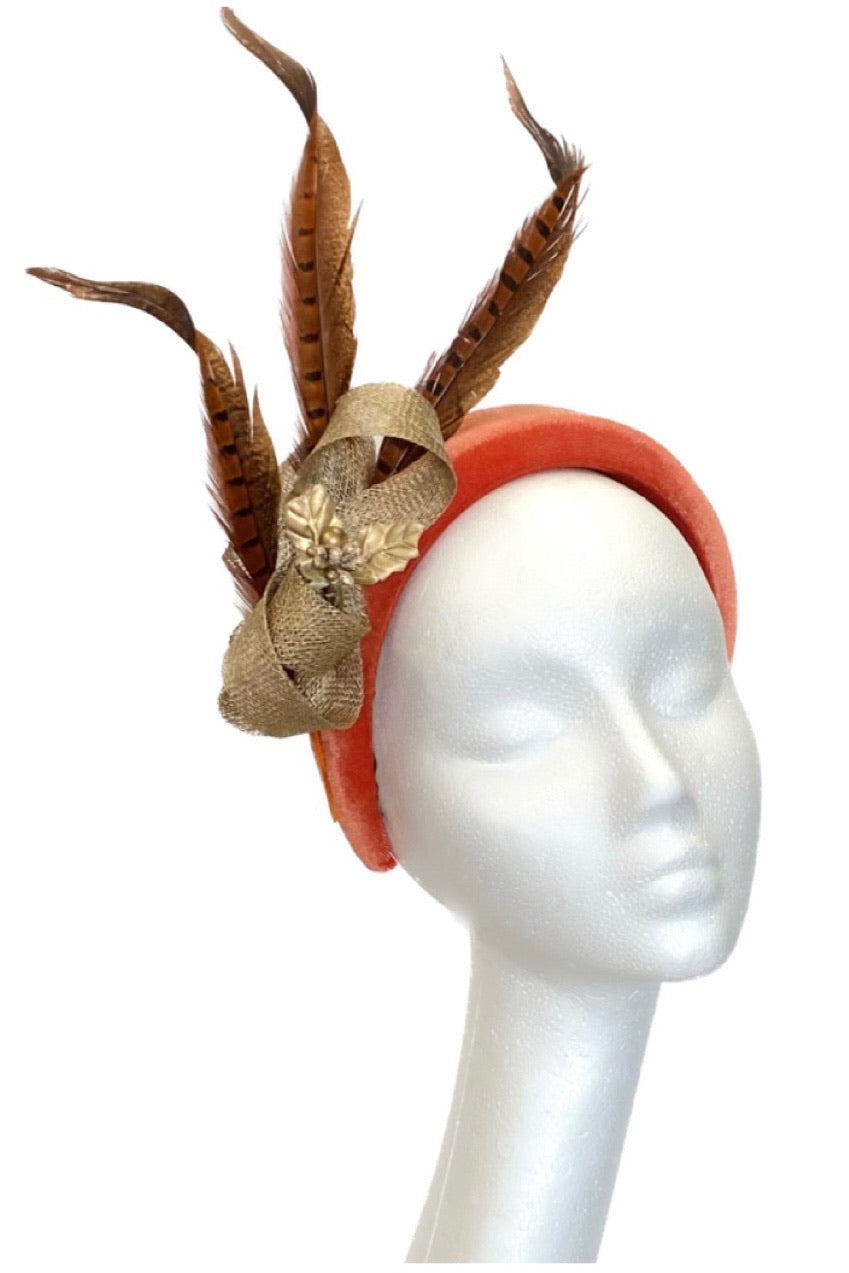 Orange velvet headband with pheasant feathers to hire