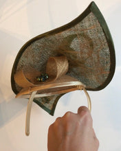 Green and gold hat for hire
