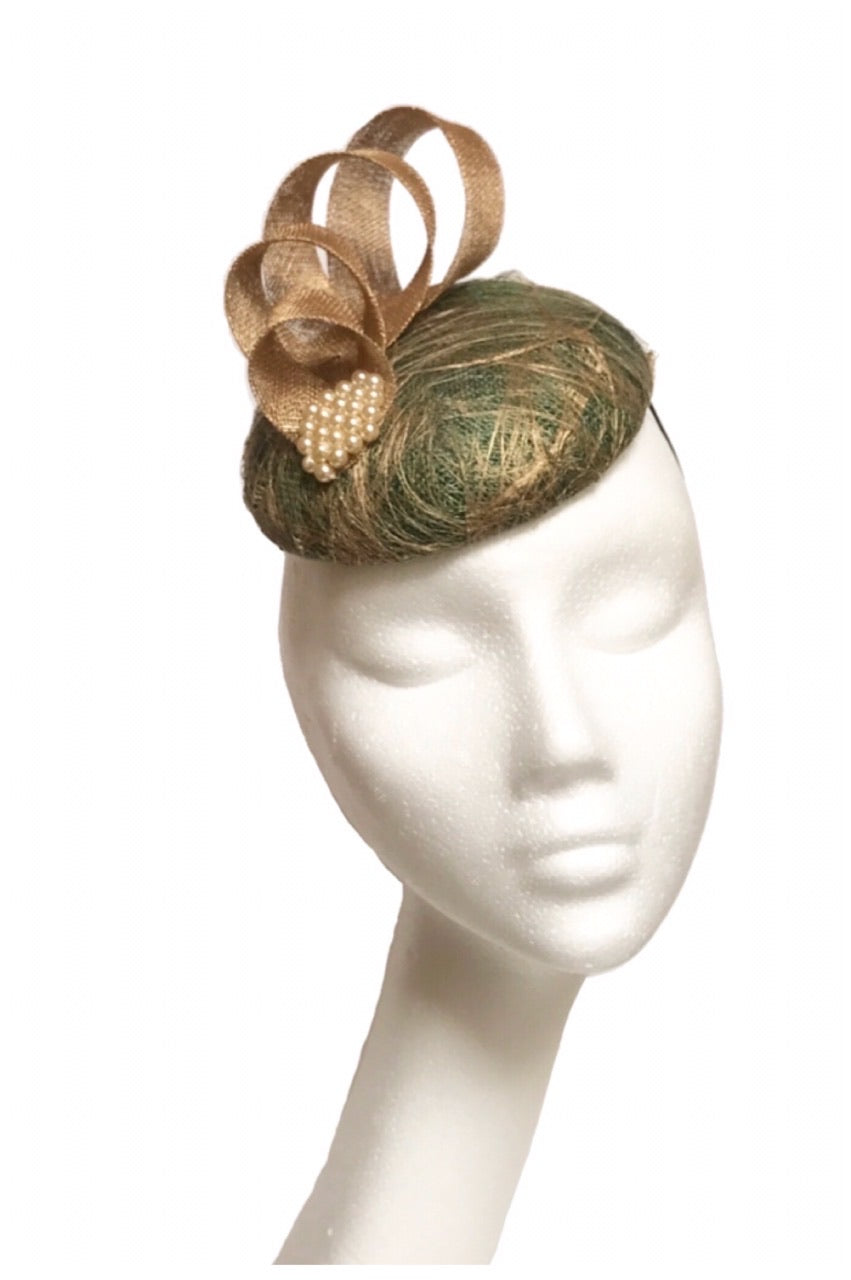 green and gold headpiece to hire