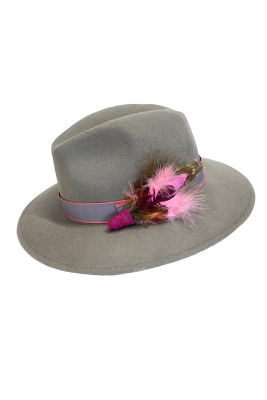 Grey fedora hat with pink feather hat pin