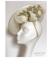 Large ivory & gold wedding hat to hire